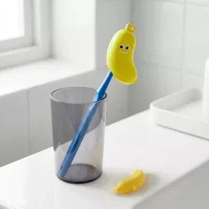 Banan-tannbørstedeksel og tannkremreiseetui for barn